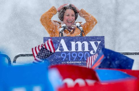U.S. Senator Amy Klobuchar brushes snow from her hair after announcing her candidacy for the 2020 Democratic presidential nomination in Minneapolis.
