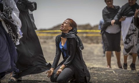 Relatives of crash victims mourn and grieve at the scene where the Ethiopian Airlines Boeing 737 Max 8 crashed shortly after takeoff, killing all 157 on board.