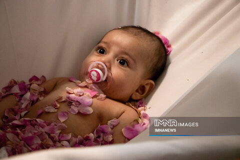  Ritual of rolling newborns in Damask roses