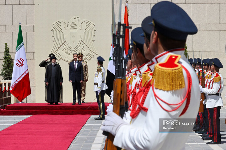 مراسم استقبال رسمی از آیت الله رئیسی توسط رئیس جمهور سوریه