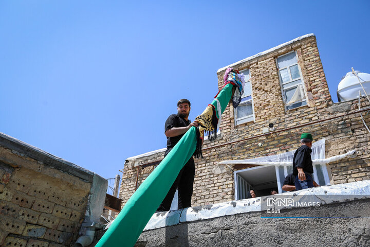 آیین علم‌گردانی در روستای هزاوه