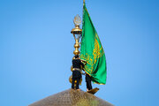 آیین تعویض پرچم گنبد حرم امام رضا (ع)